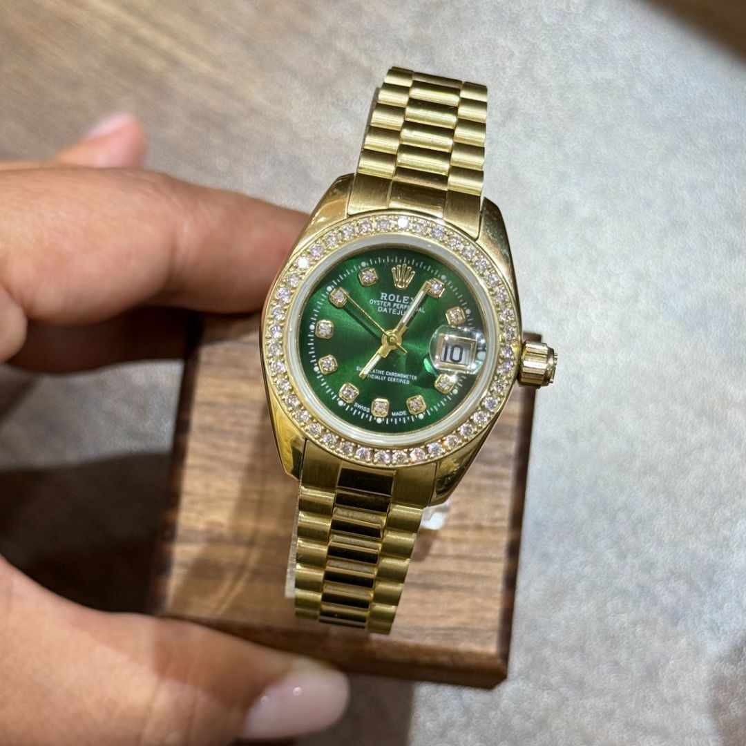 Золотые часы Rolex с зеленым циферблатом