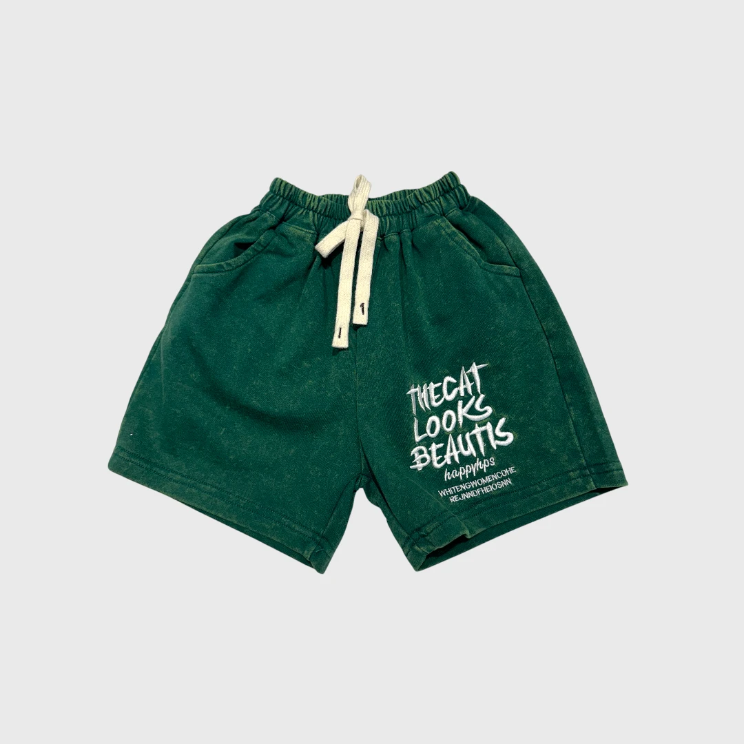 Зеленые шорты с принтом для детей