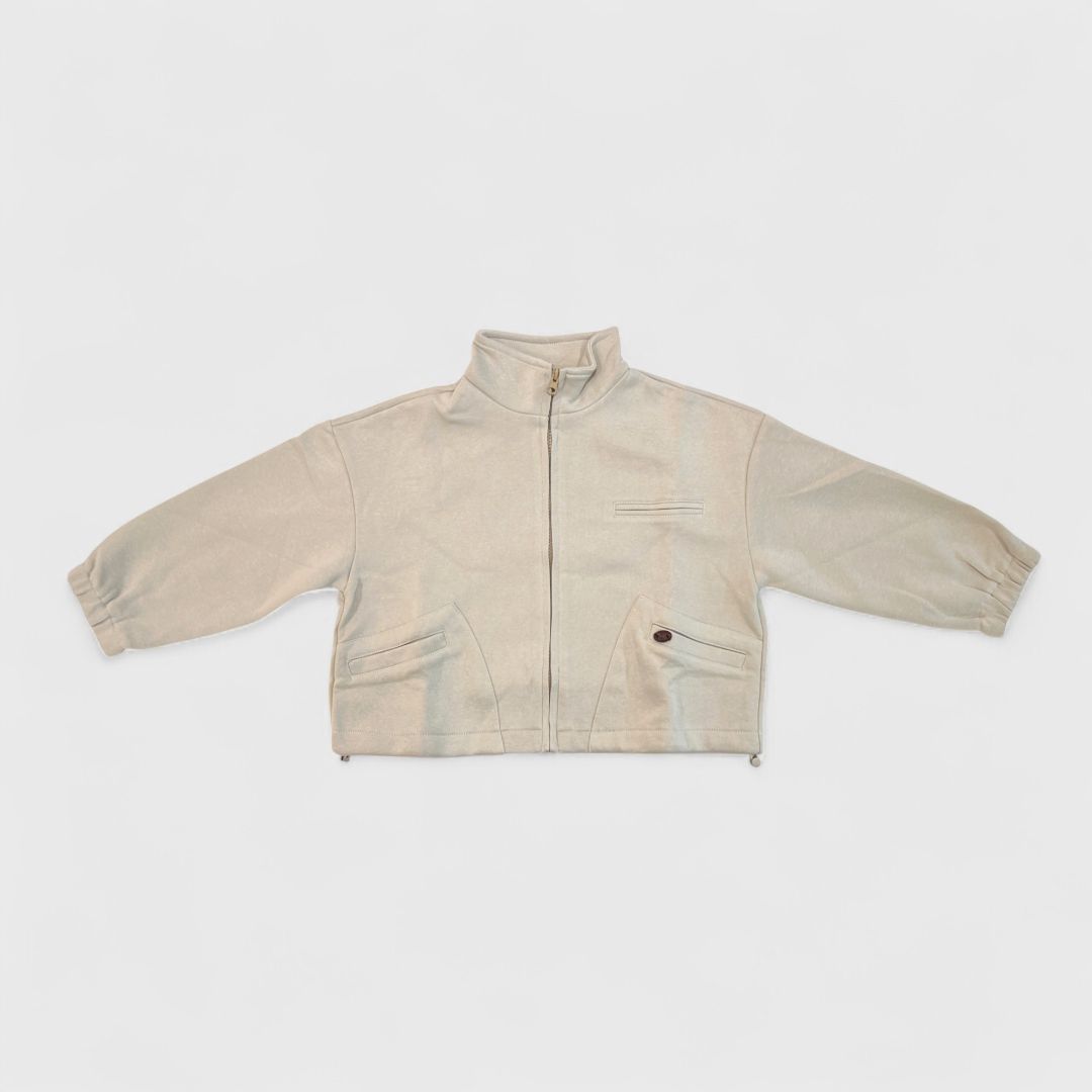 Бежевый трикотажный жакет на замке