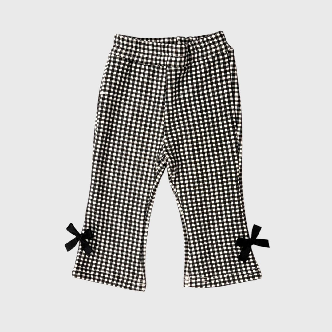 Черные брюки в клетку с бантиками