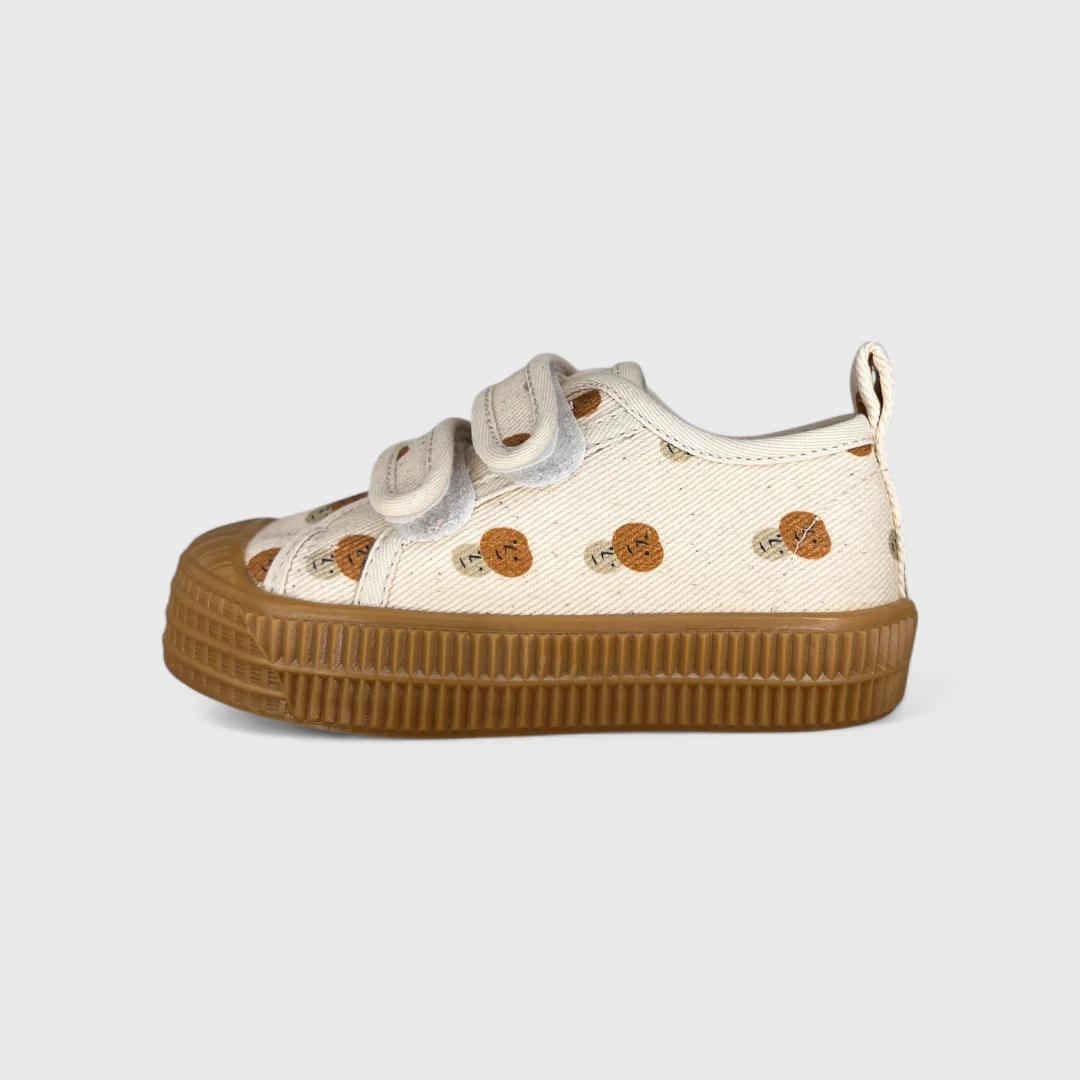 Бежевые кеды с принтом